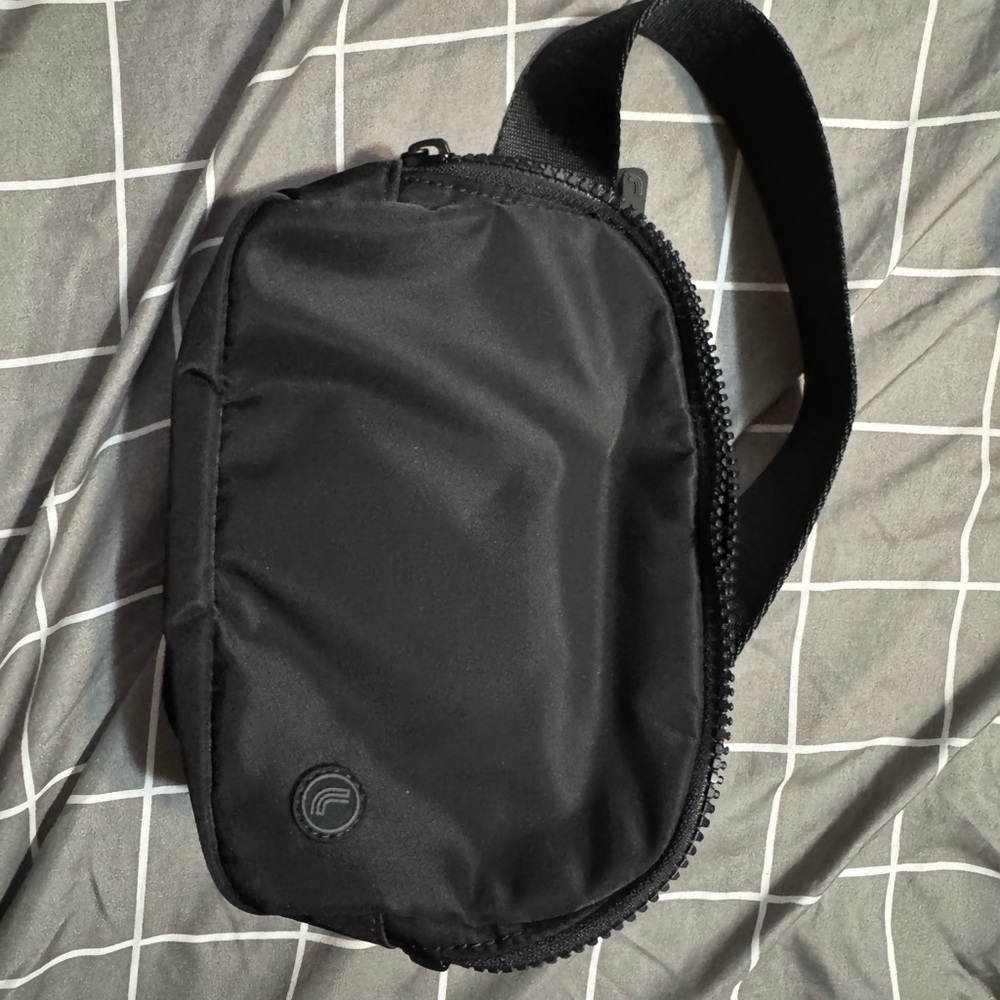 Black Belt Bag with Sleek Design and Zipper Closure